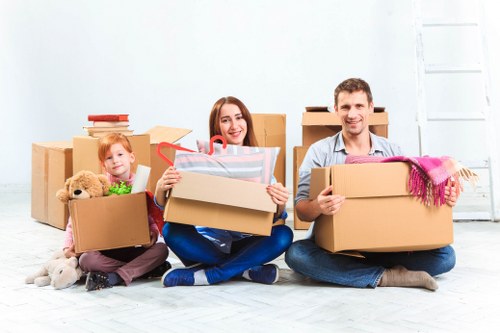 Packed boxes and wrapped furniture ready for a local move in Wormwood Scrubs