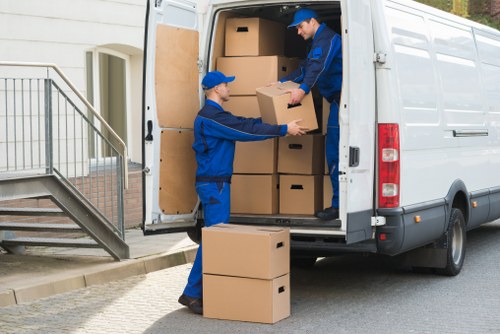 Staff loading furniture carefully during a Wormwood Scrubs van move