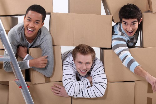 Packed moving boxes and furniture ready for transport