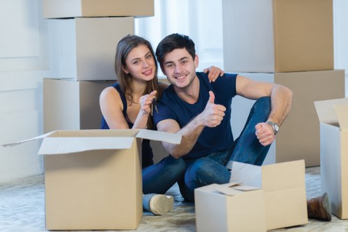 Team managing a flat move with stairs and careful lifting