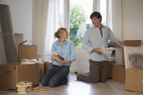 Two movers handling items safely with communication and control