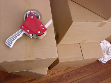 Packed boxes and furniture ready for collection by removal services
