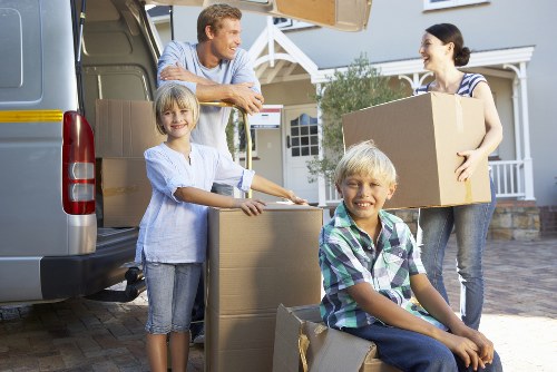 Local office movers handling furniture and equipment carefully